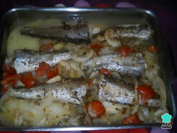 Recette de merlu au four avec pommes de terre et oignons